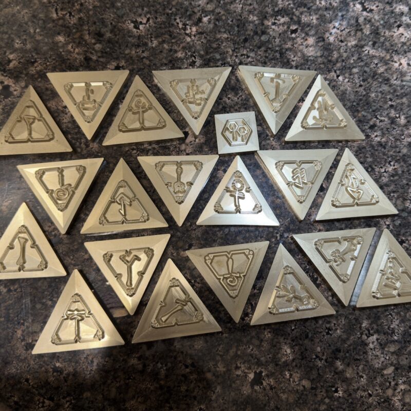 Lavriv Studio commissioned the development and manufacturing of a custom brass embossing die set featuring rune-inspired symbols for leather goods production.